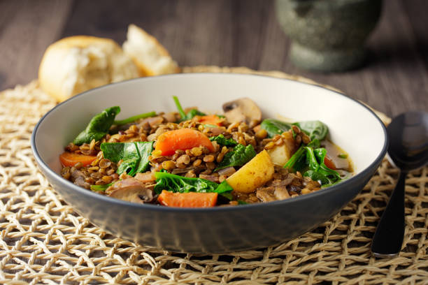 Home made freshness green lentil with baby potato,carrot,mushroom and spinach stew service with ciabatta bread for vegan
