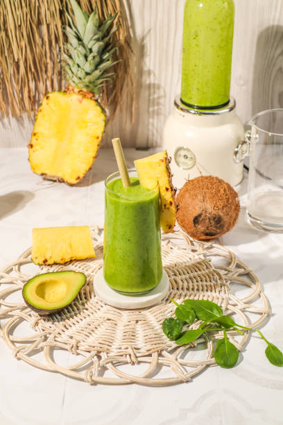 Healthy Green smoothie drink with avocado, pineapple, coconut and spinach